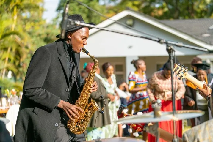 Jose Sax playing at an outdoor wedding