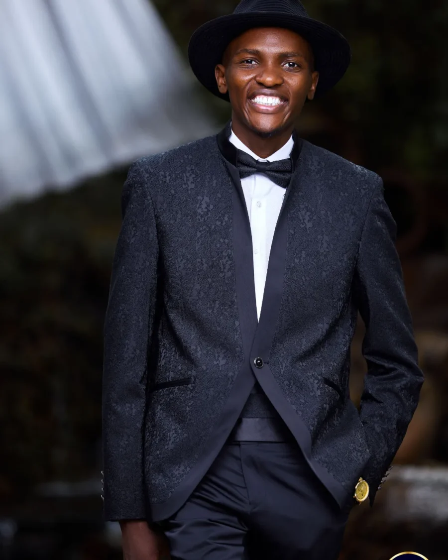Portrait of Jose Sax in a black tuxedo and hat